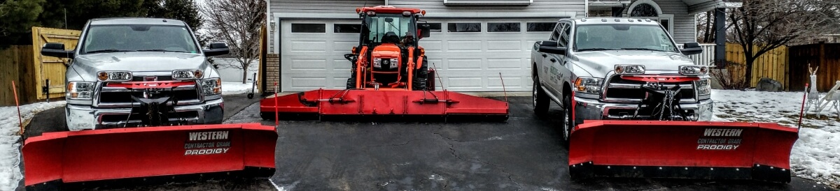 Snow being cleared from a roof to prevent ice dams